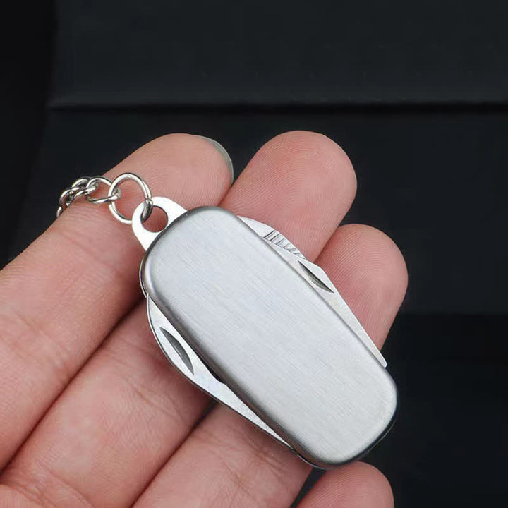 Silver Compact Folding Knife Keychain With Bottle Opener - image 1