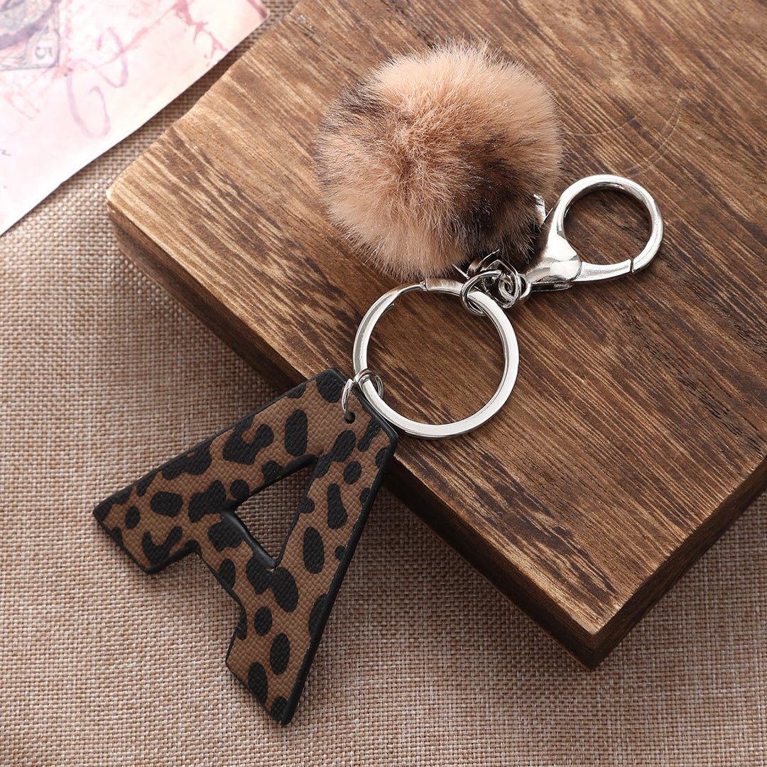 Western Style Leopard Print Letter Leather Keychain With Plush Ball - image 1