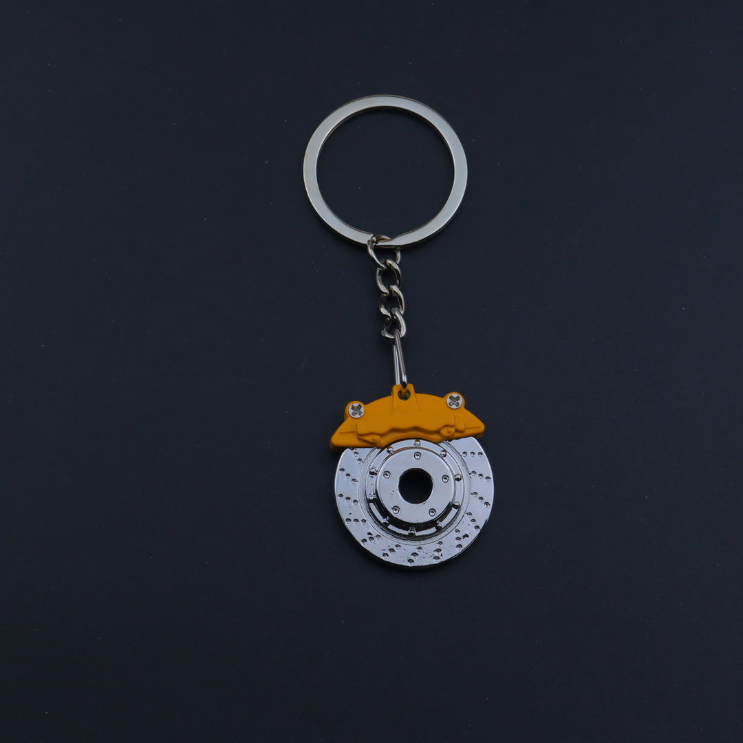 Mini Modern Car Parts Design Keychain Collection - Yellow Brake - image 1