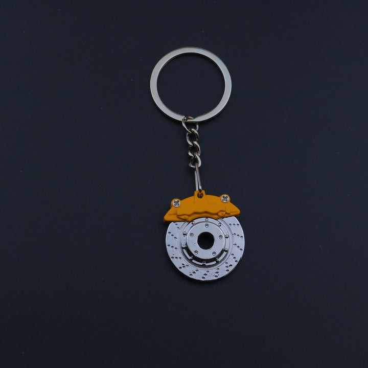 Mini Modern Car Parts Design Keychain Collection - Yellow Brake - image 1